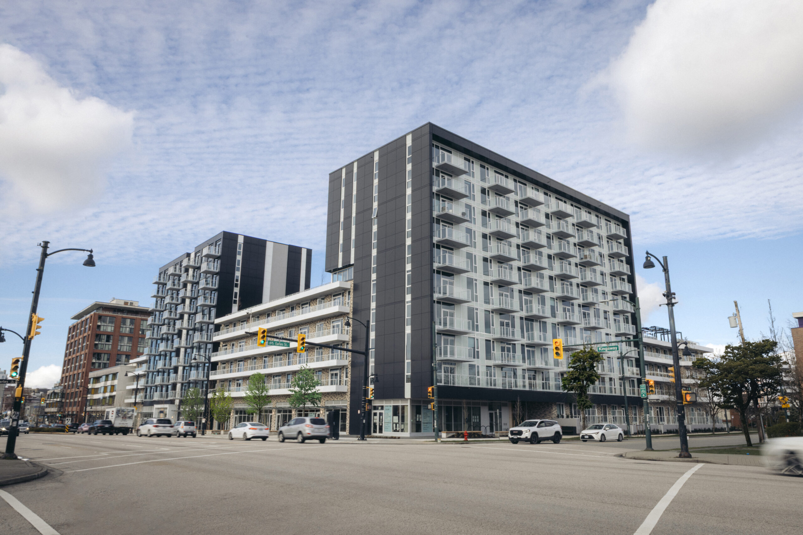 Frame concrete condominium building on Kingsway in East Vancouver, completed and move-in ready